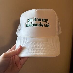 White Trucker Hat with Green Embroidery “Put it on my husbands tab”